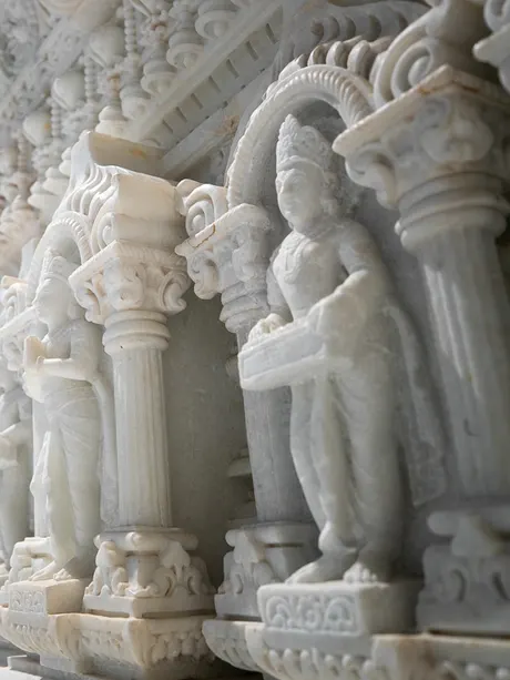 Carved white marble pillars and niches